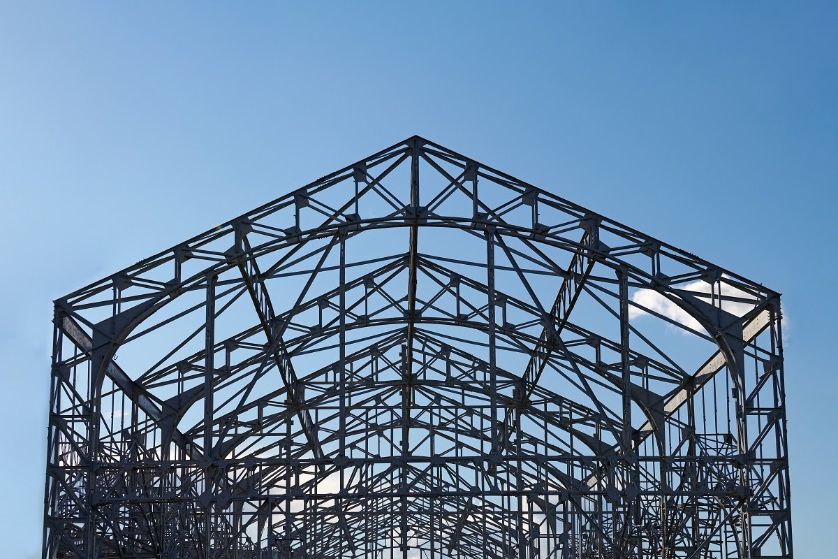 Exposed steel columns and roof trusses of a building under construction